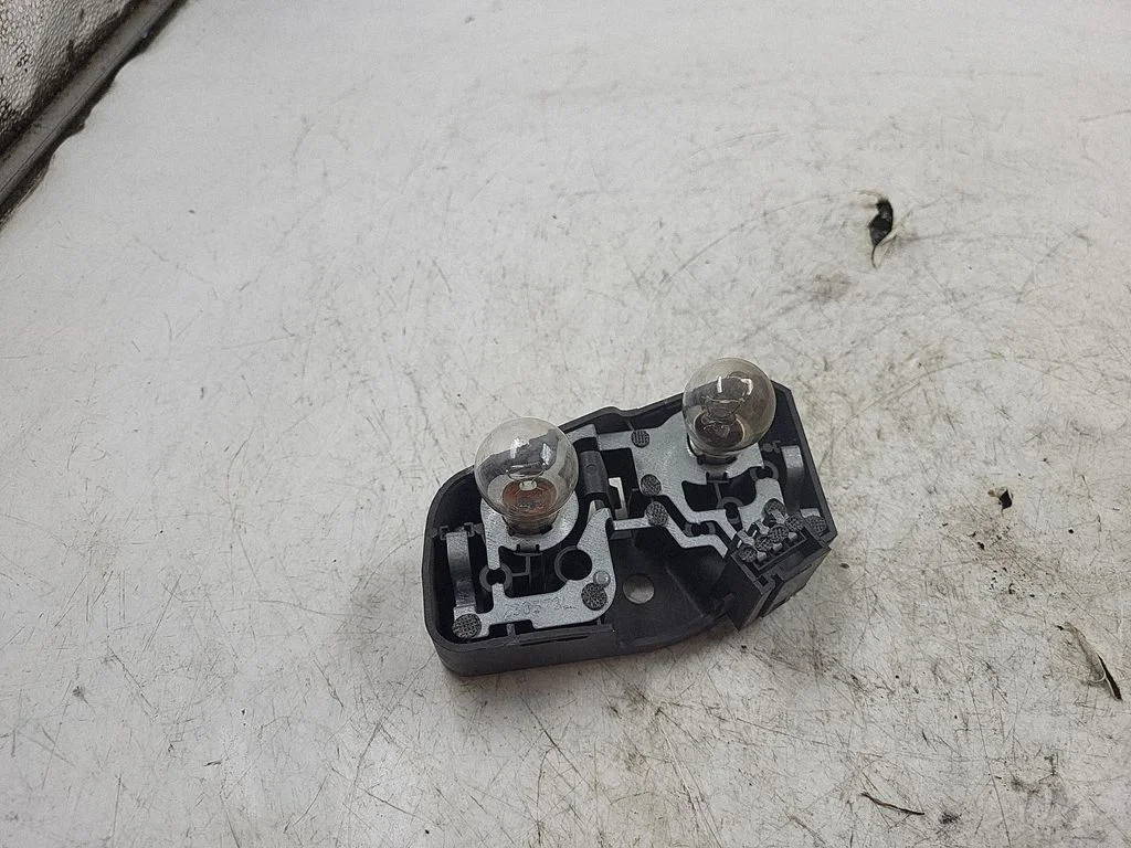 Tail light bulb cover holder 388569L