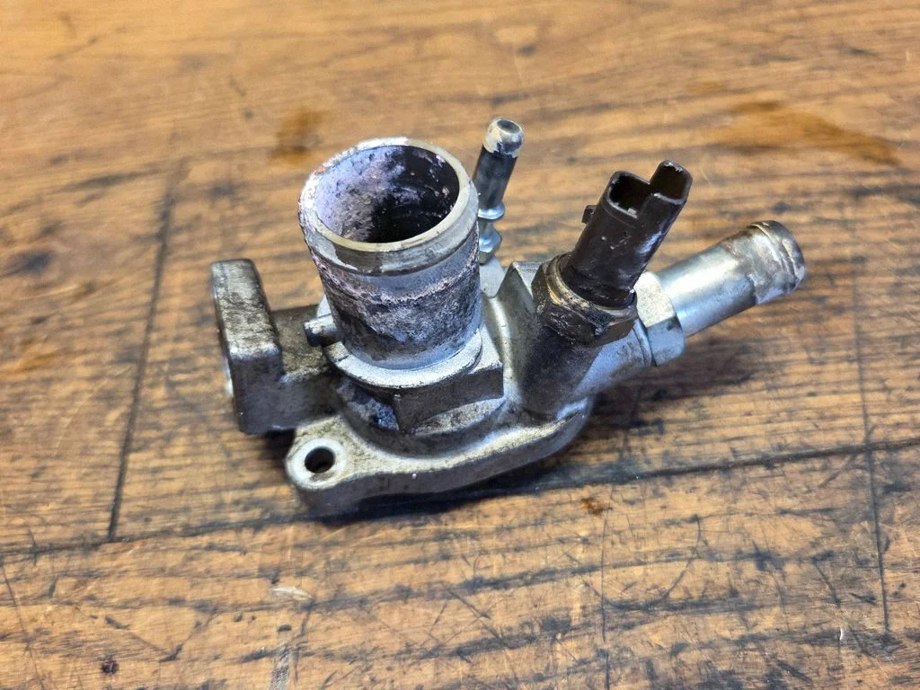 Thermostat/thermostat housing