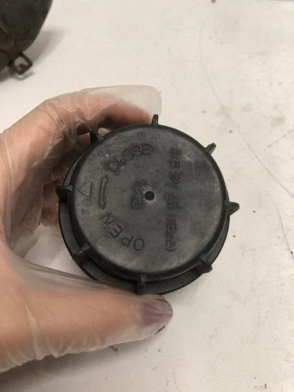 Headlight washer spray nozzle cap/cover