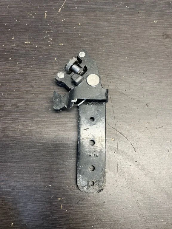 Front door check strap stopper