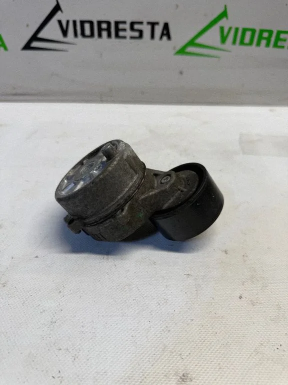 Alternator belt tensioner