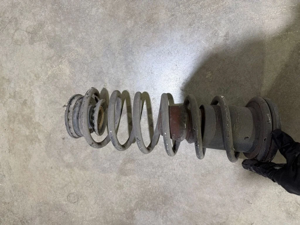 Rear coil spring – rear left