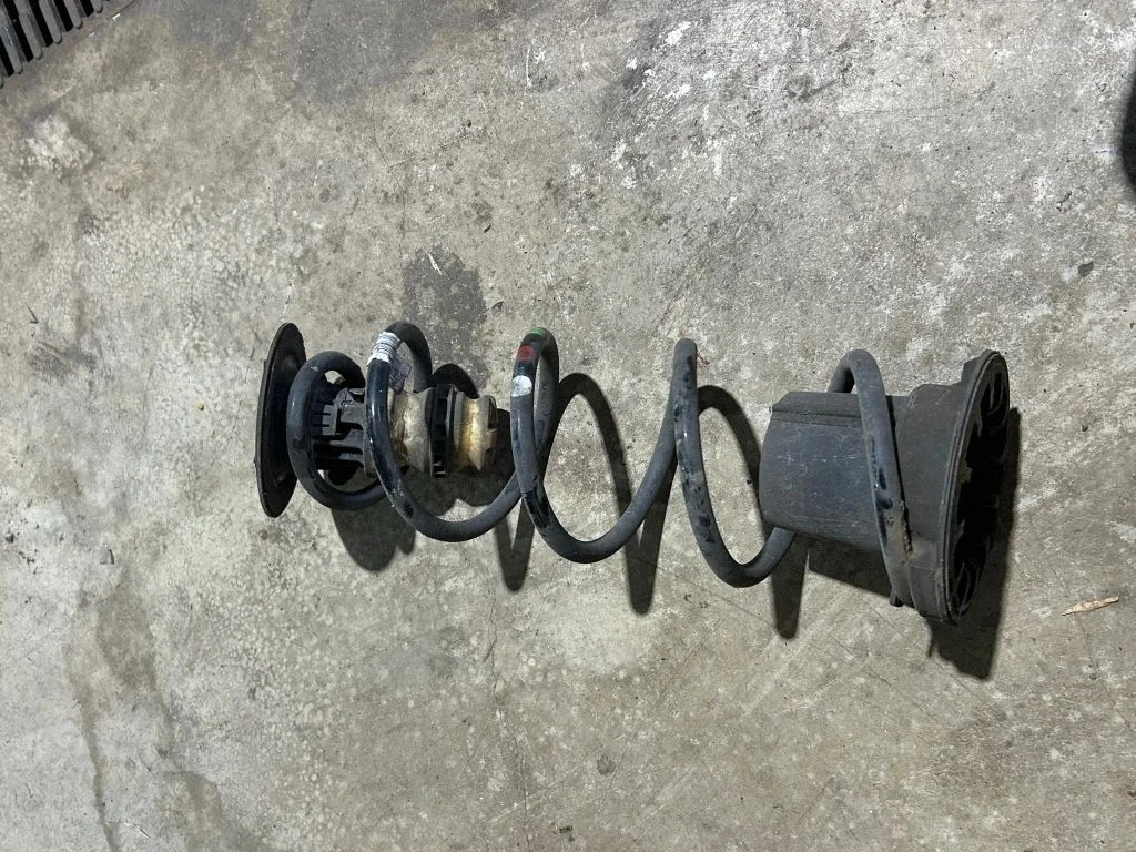 Rear coil spring – rear left