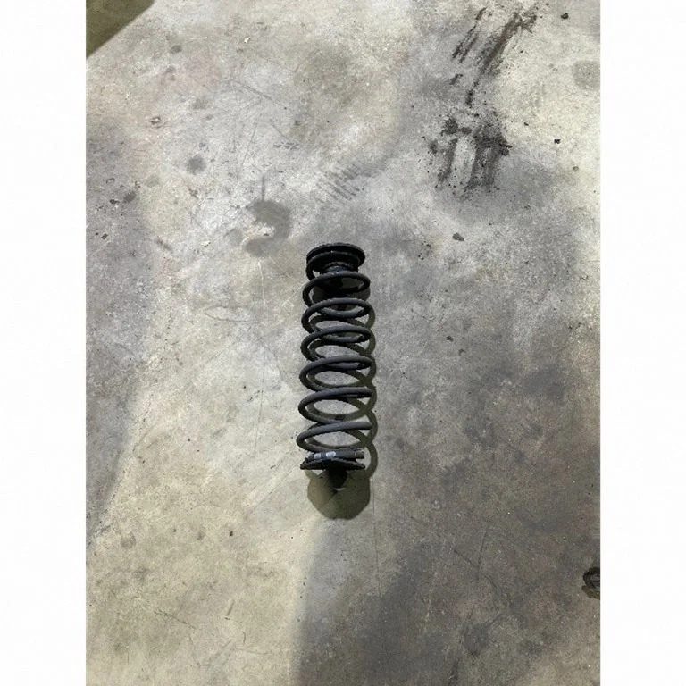 Rear coil spring – left