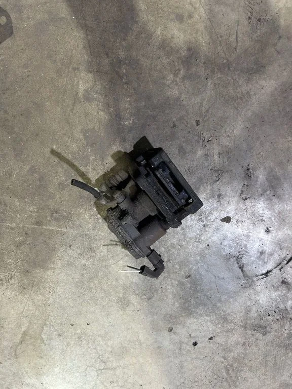 Rear brake caliper – left
