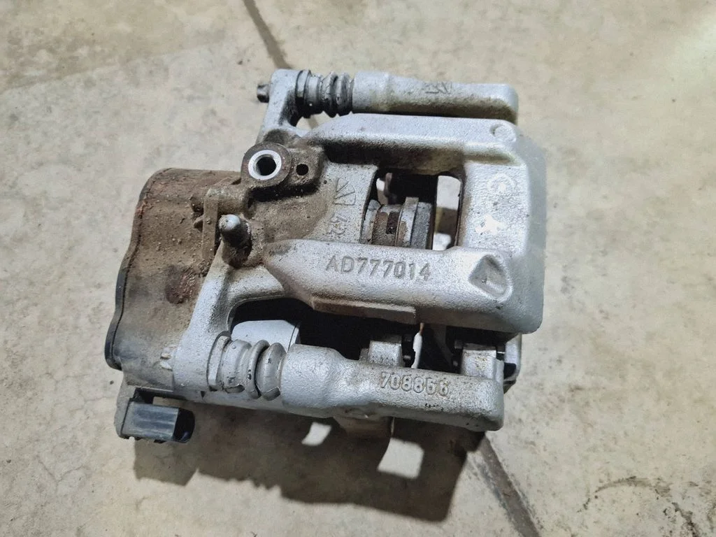 Rear brake caliper AD777014