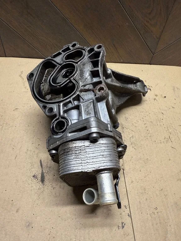 Oil filter mounting bracket CX236L625AA