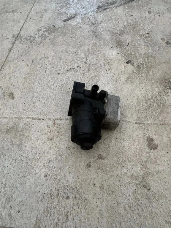 Oil filter mounting bracket 03L117021C