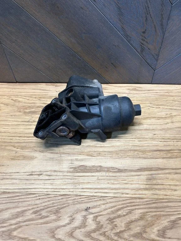 Oil filter mounting bracket 264102A300