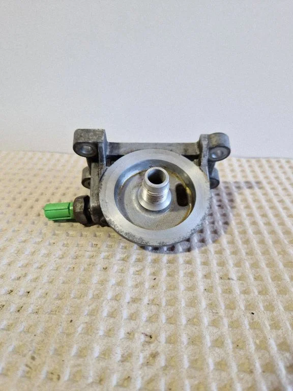 Oil filter mounting bracket FR3E6884GC