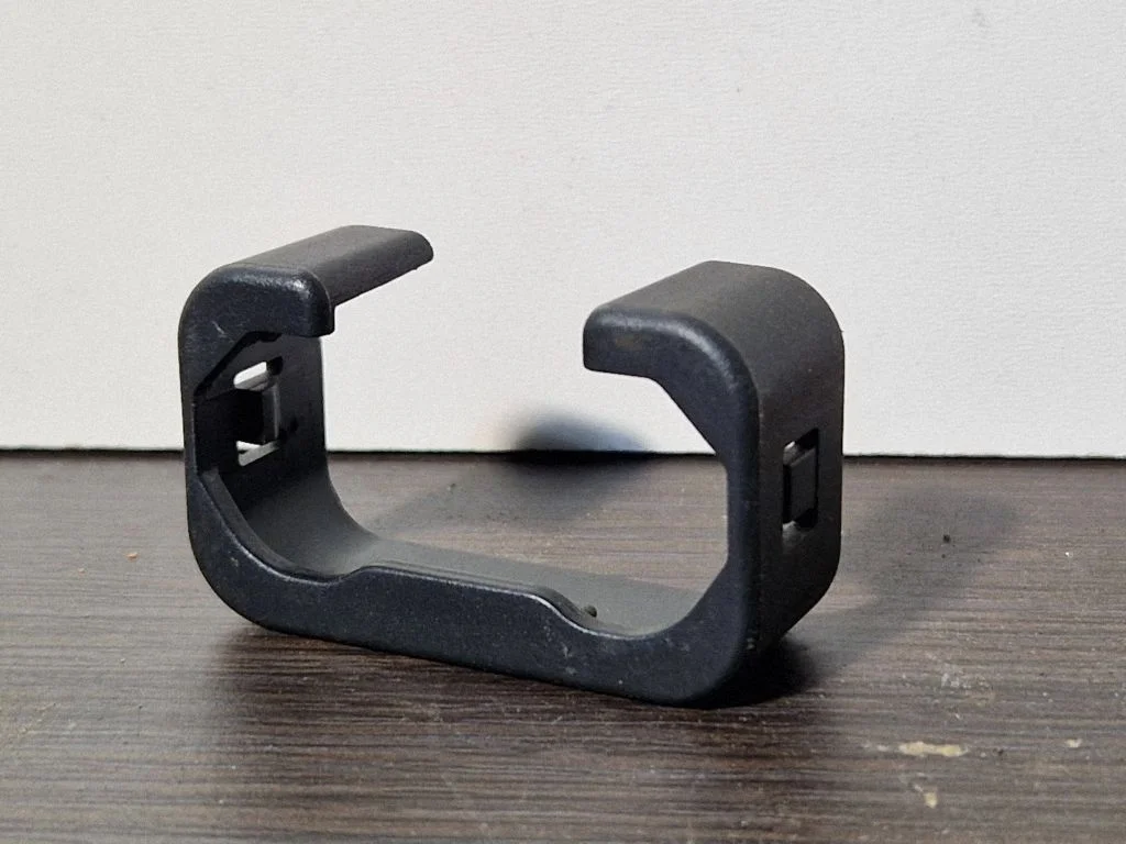 Front driver seat rail trim