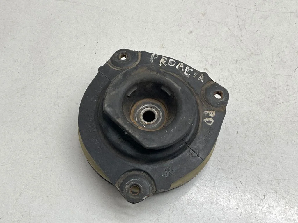 Front coil spring rubber mount 543201KA0B