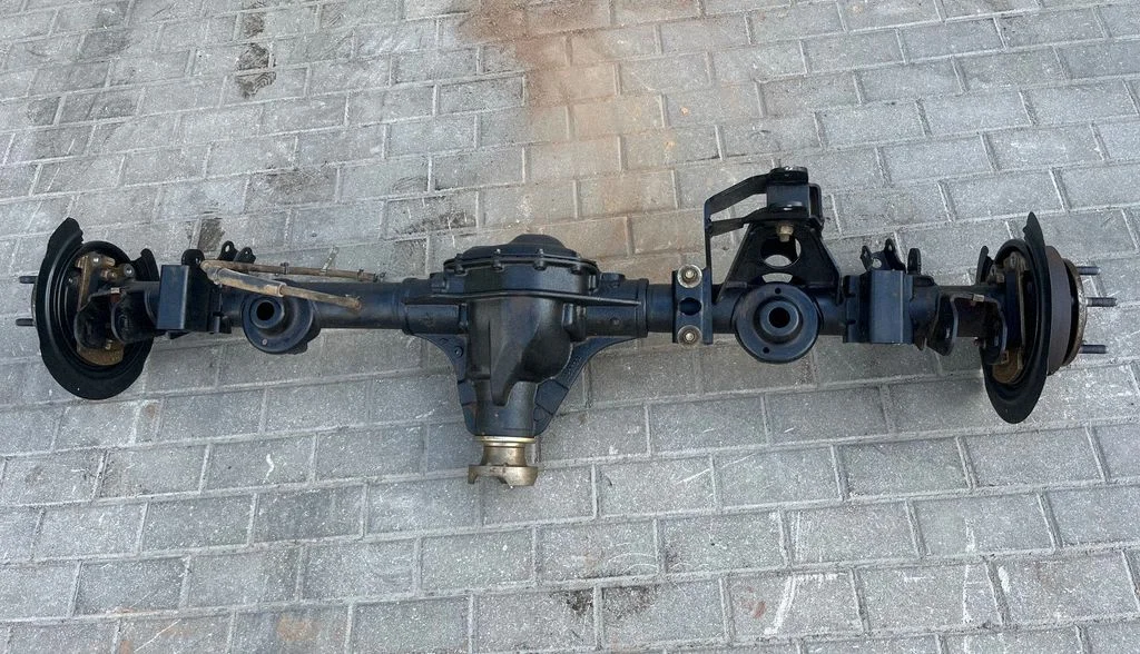 Rear axle beam with reductor