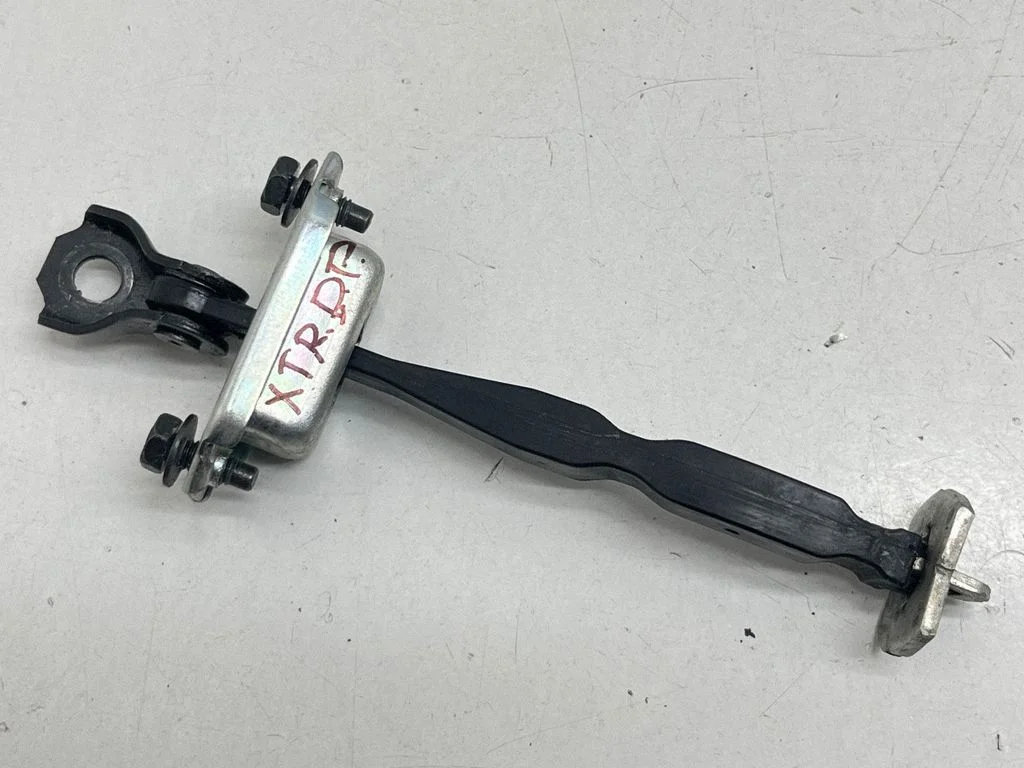 Front door check strap stopper – front right