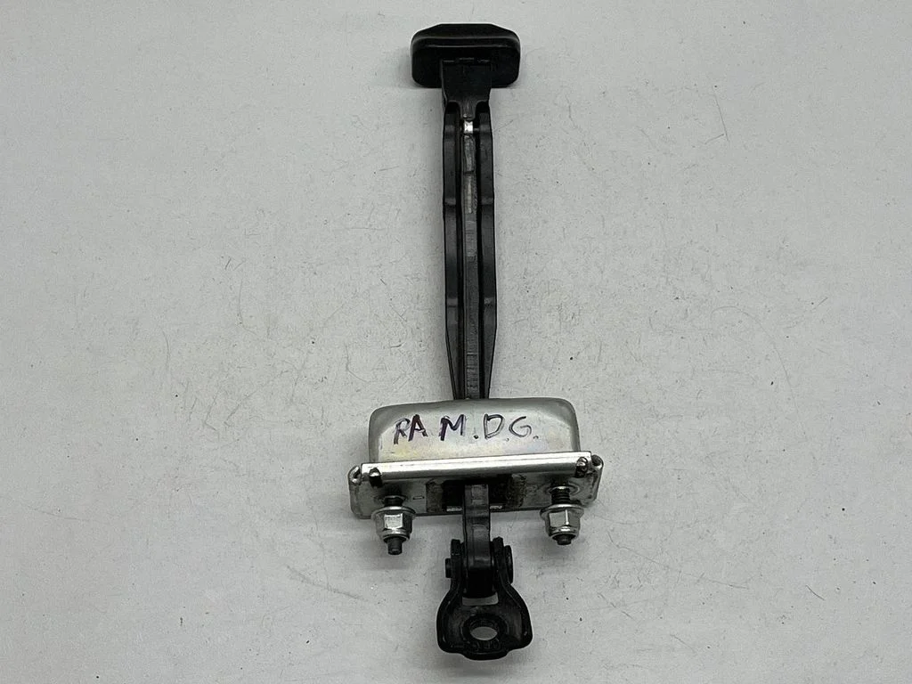 Rear door check strap stopper QUAD587AE