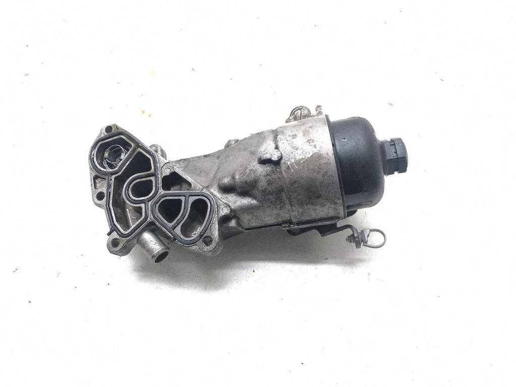 Oil filter mounting bracket 1103S7