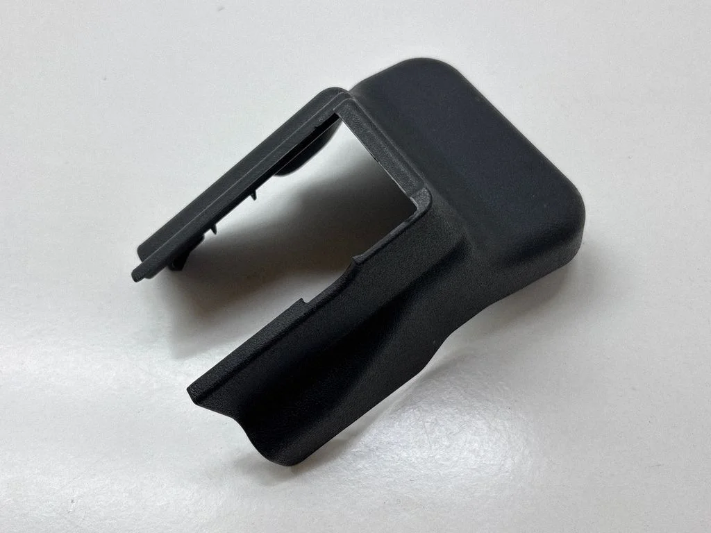 Front passenger seat rail trim 721230E090