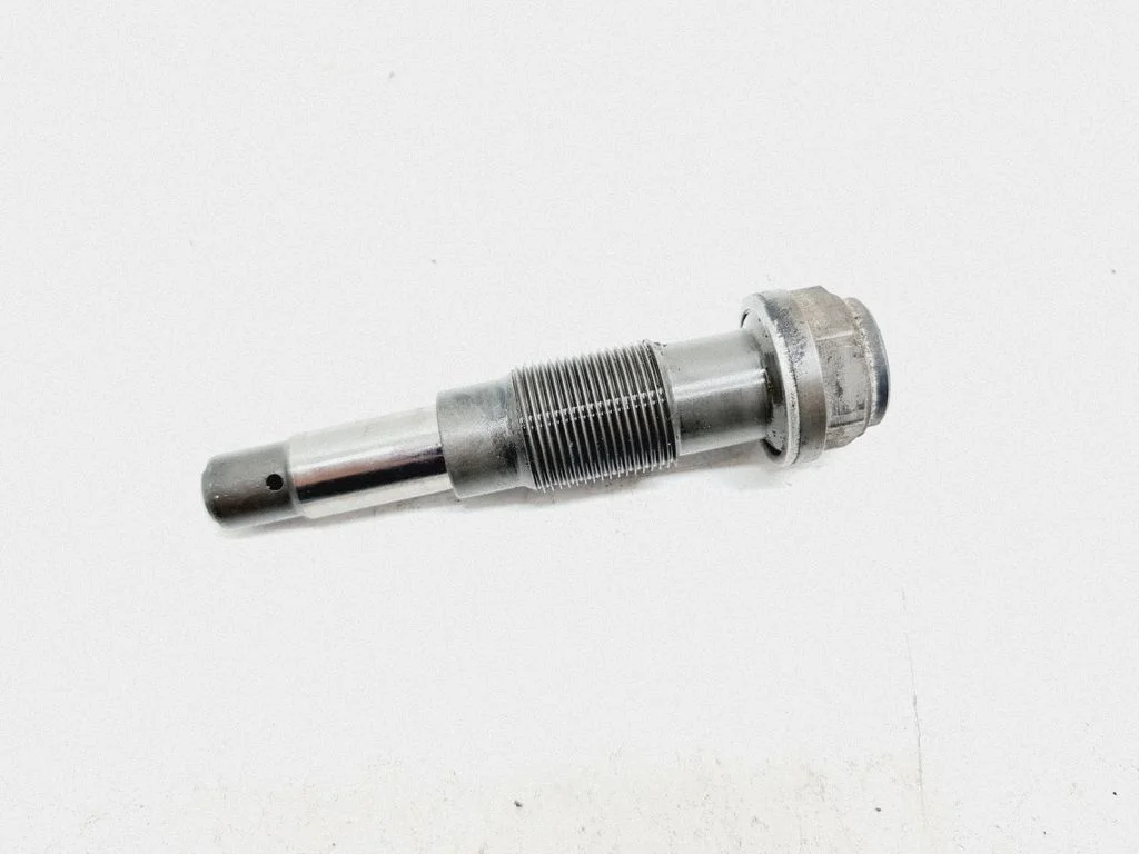 Timing belt/chain tensioner