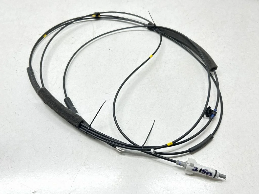 Fuel cap flap release cable
