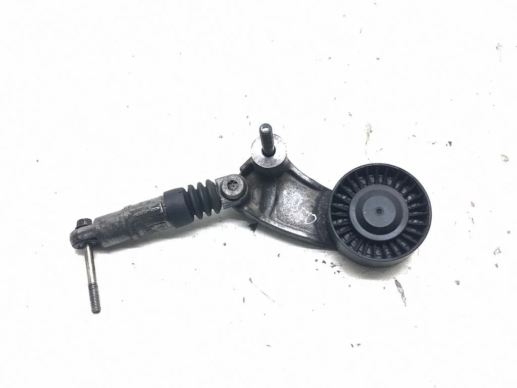 Alternator belt tensioner