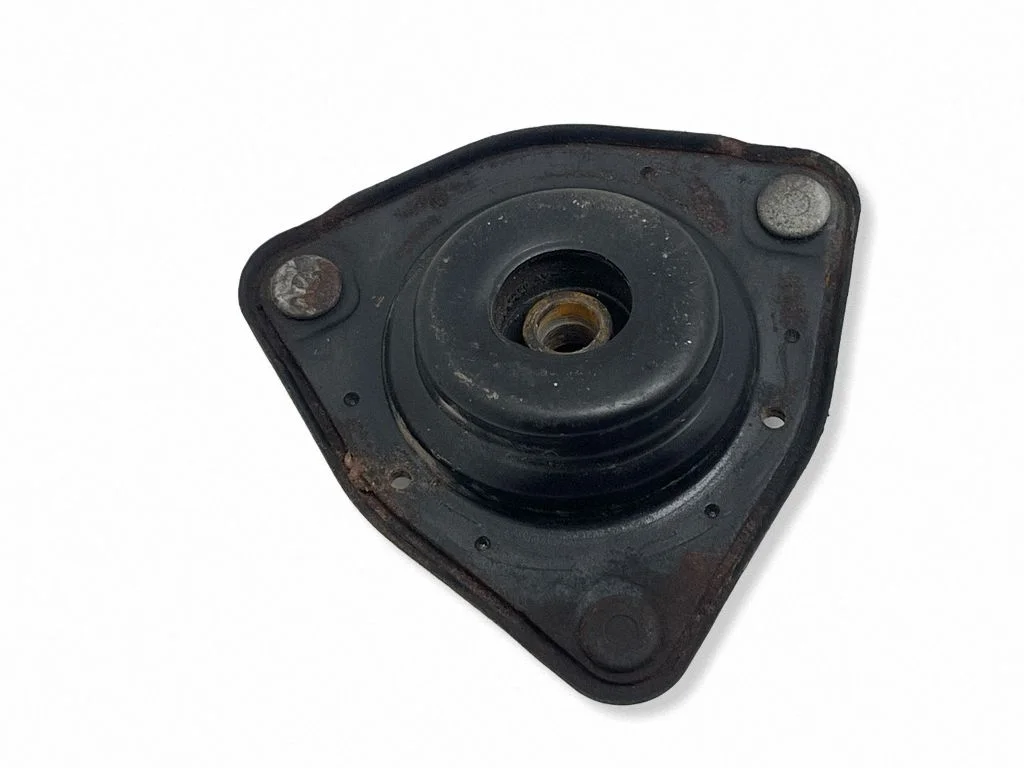 Front shock absorber mounting bracket – front left