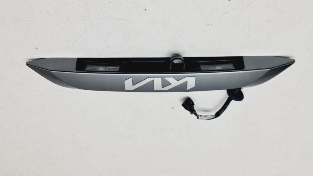 Trunk door license plate light bar 87311AT000
