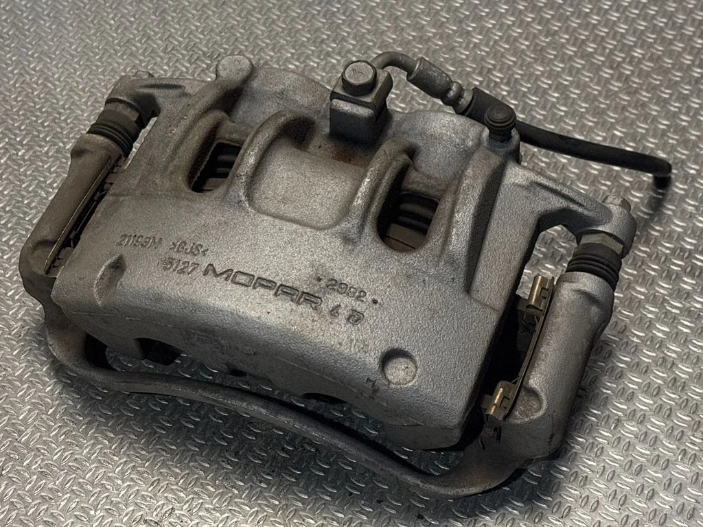 Front brake caliper 63358076AB