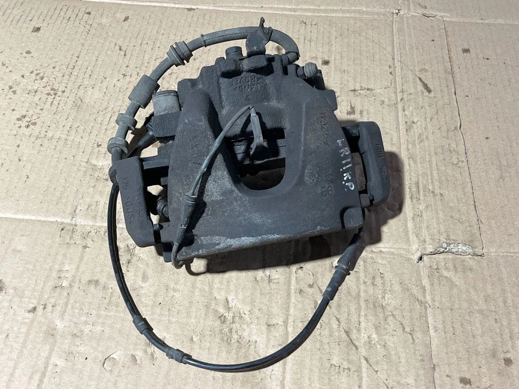 Front brake caliper 1A426M