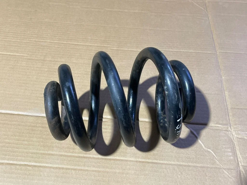 Rear coil spring – rear left