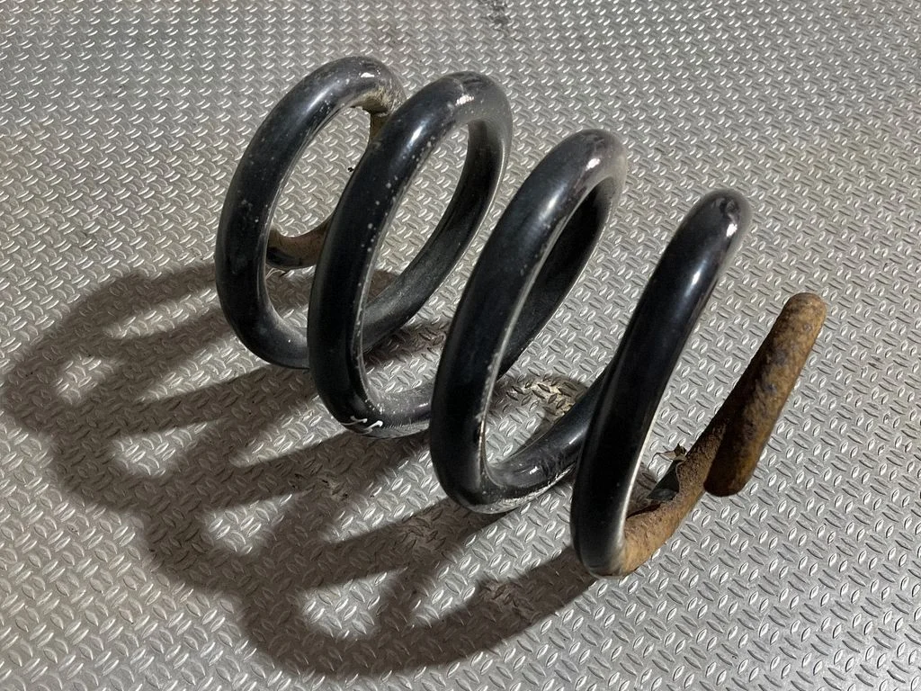 Rear coil spring – rear left