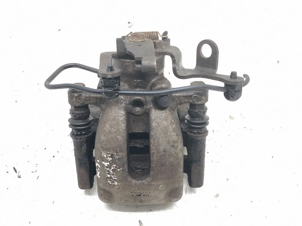 Rear brake caliper – left
