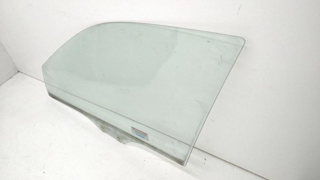 Front door window glass four-door – front left