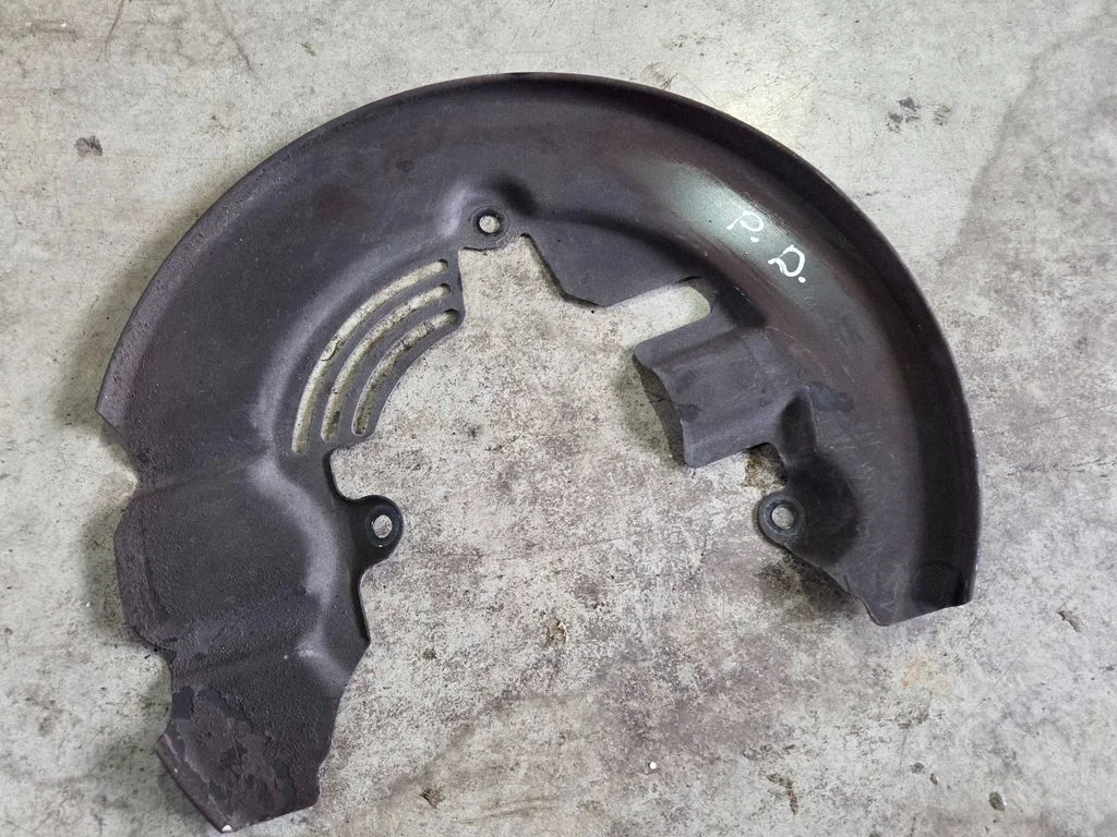 Front brake disc dust cover plate KV612C448AB