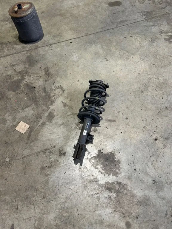 Front shock absorber with coil spring – front right