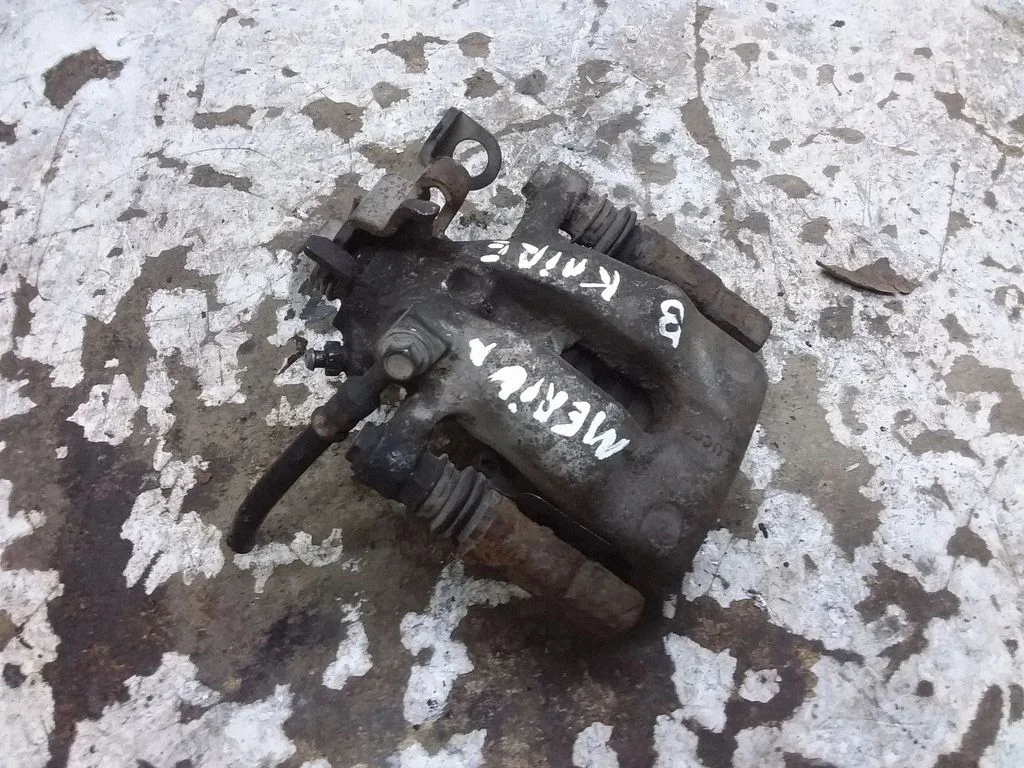 Rear brake caliper – left