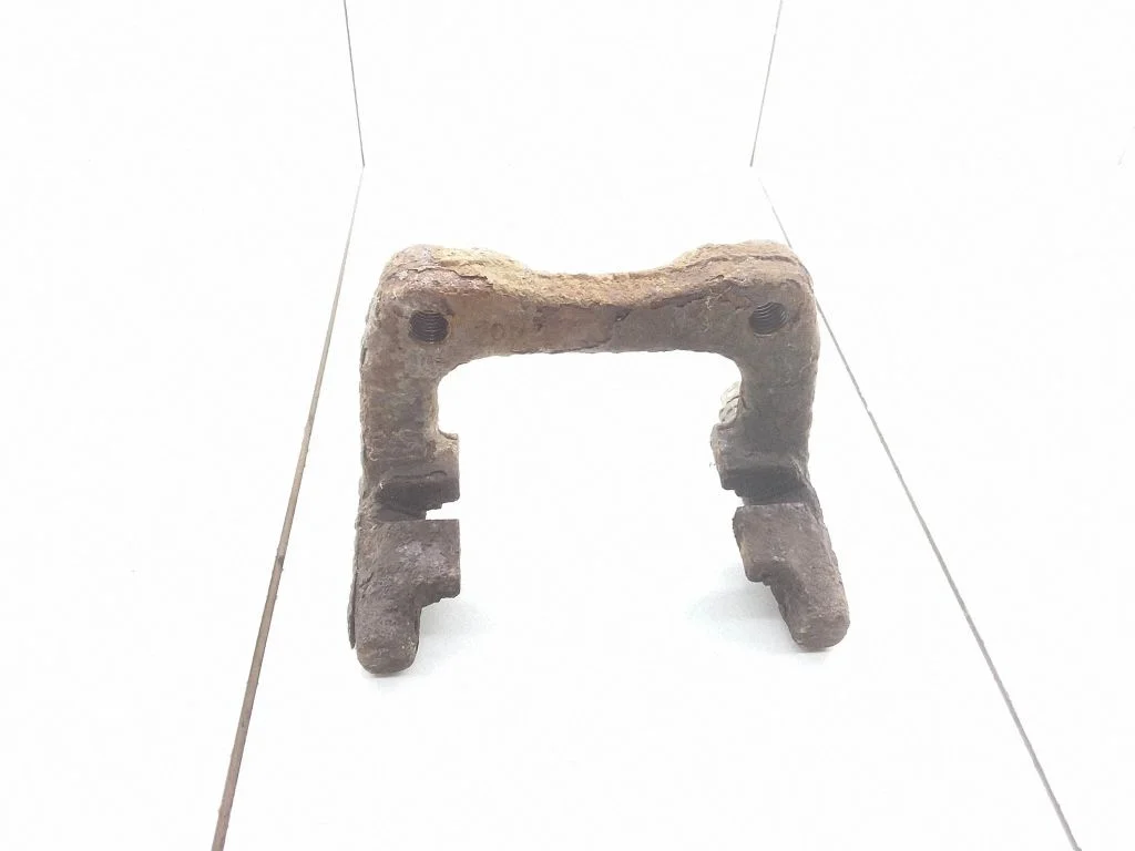 Brake caliper pad carrier rear