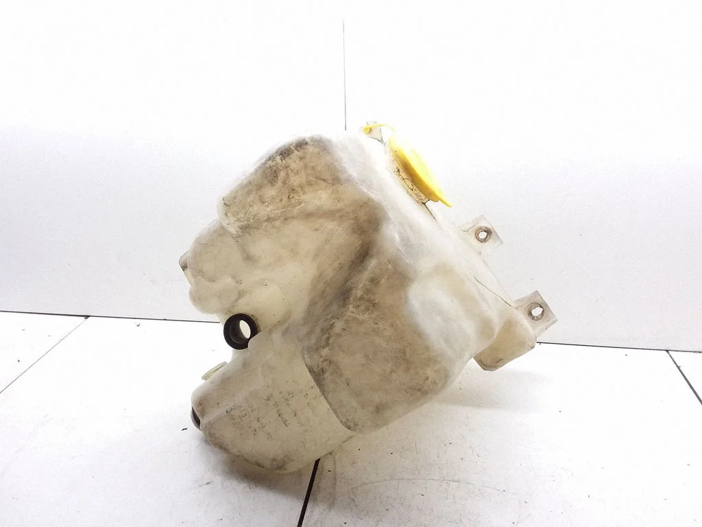 Lamp washer fluid tank – Subaru Legacy (1990-1998)