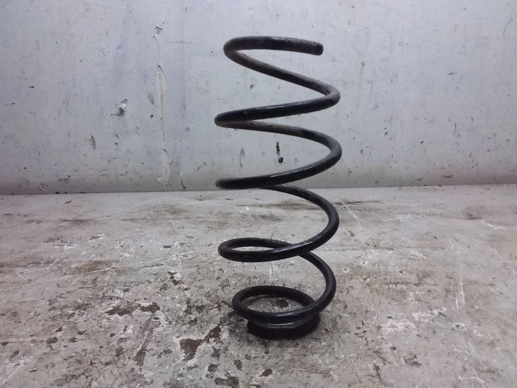 Rear coil spring – left