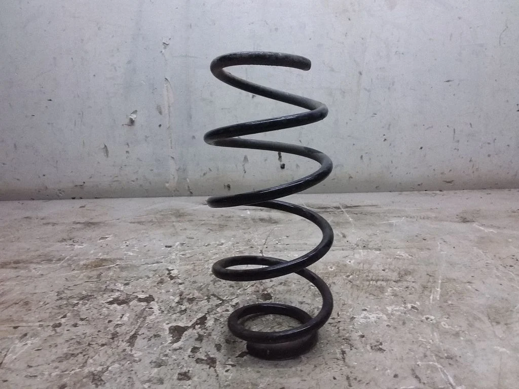 Rear coil spring – left