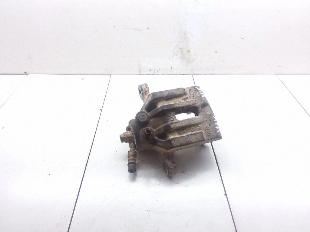 Rear brake caliper – left