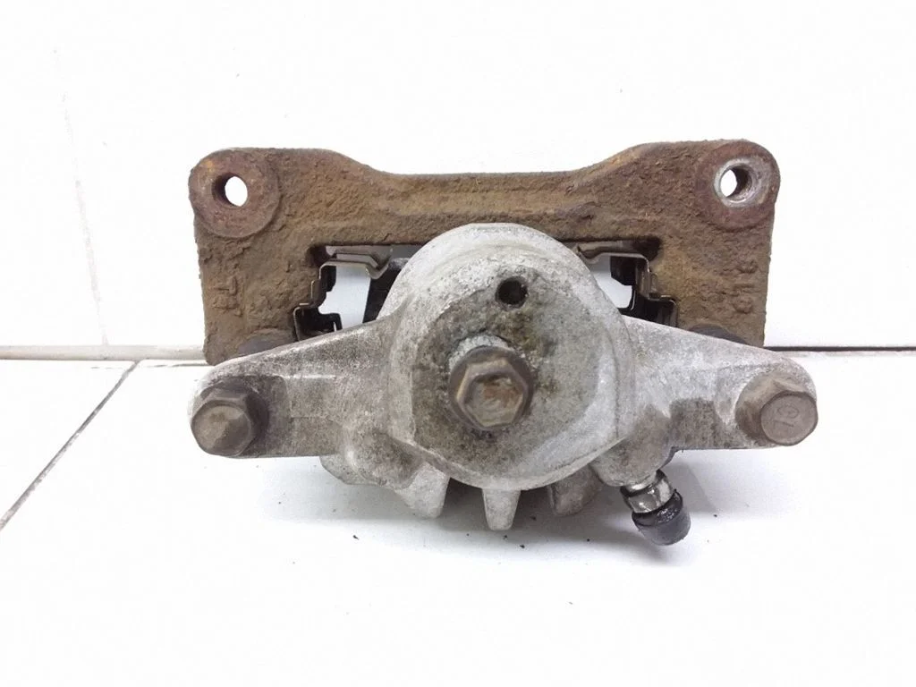 Rear brake caliper – right