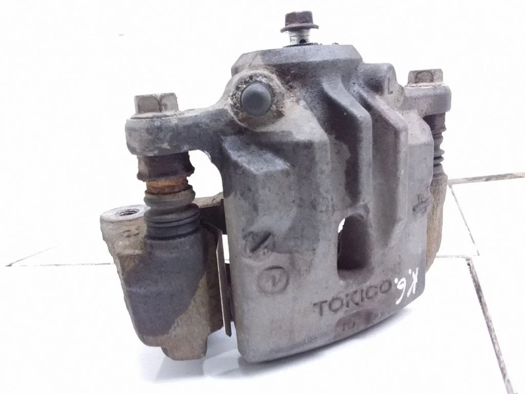 Rear brake caliper – left