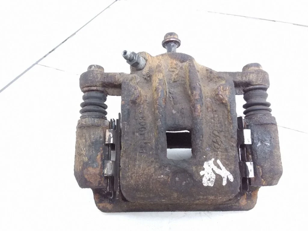 Rear brake caliper – left