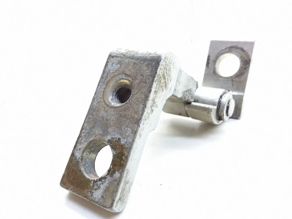 Front door upper hinge – left