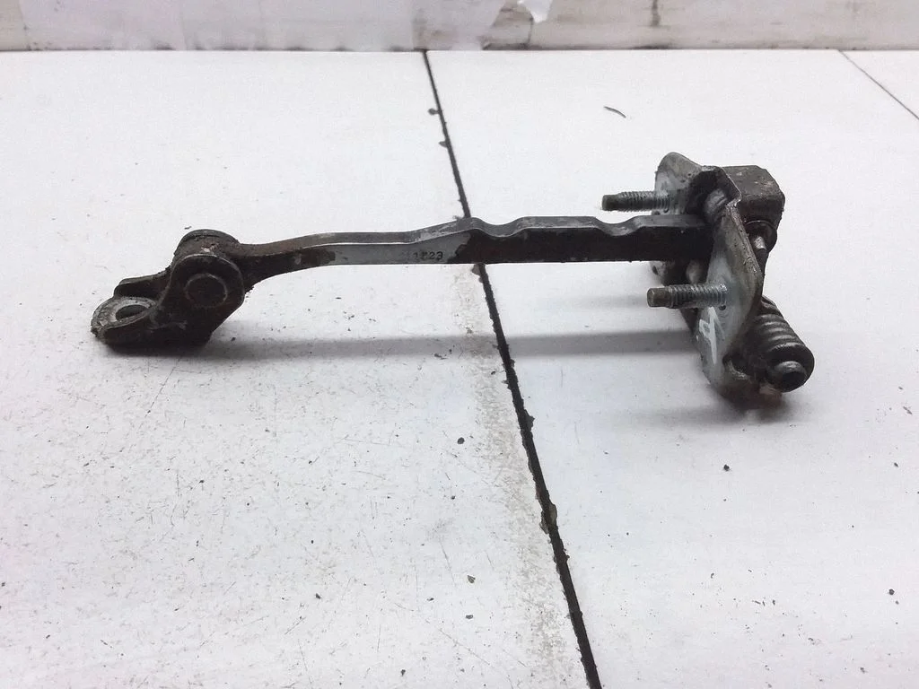 Front door check strap stopper 311823