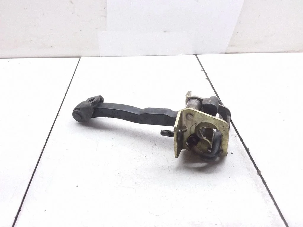 Front door check strap stopper 30661442