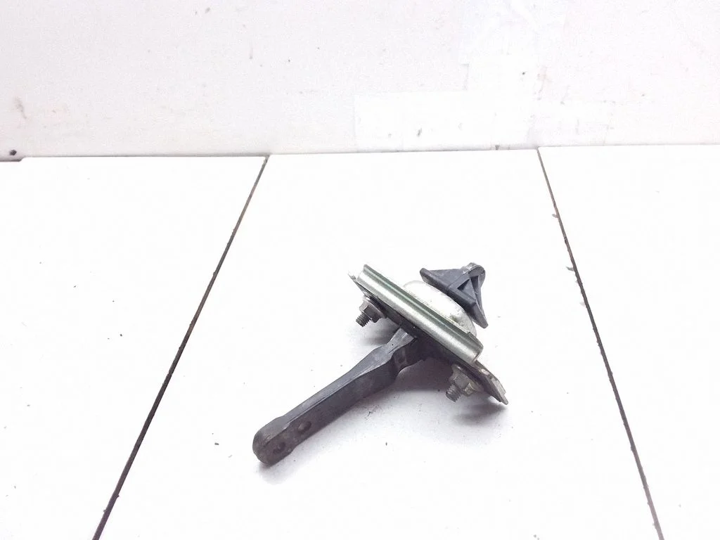 Front door check strap stopper – left
