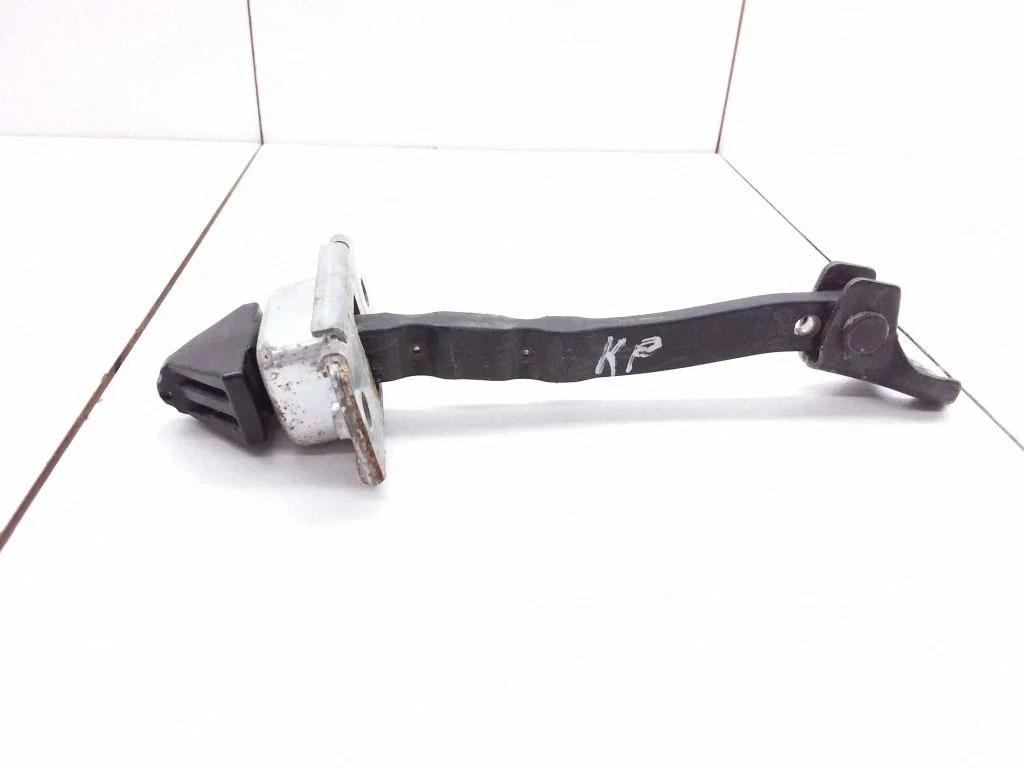 Front door check strap stopper
