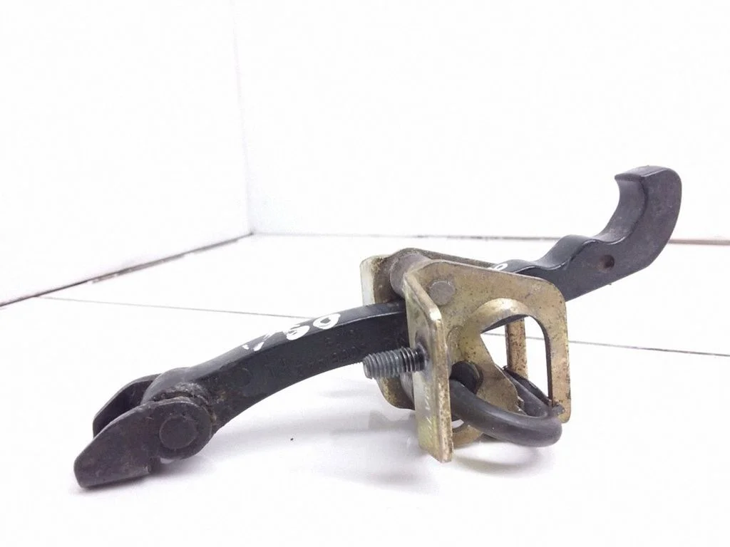 Front door check strap stopper – left
