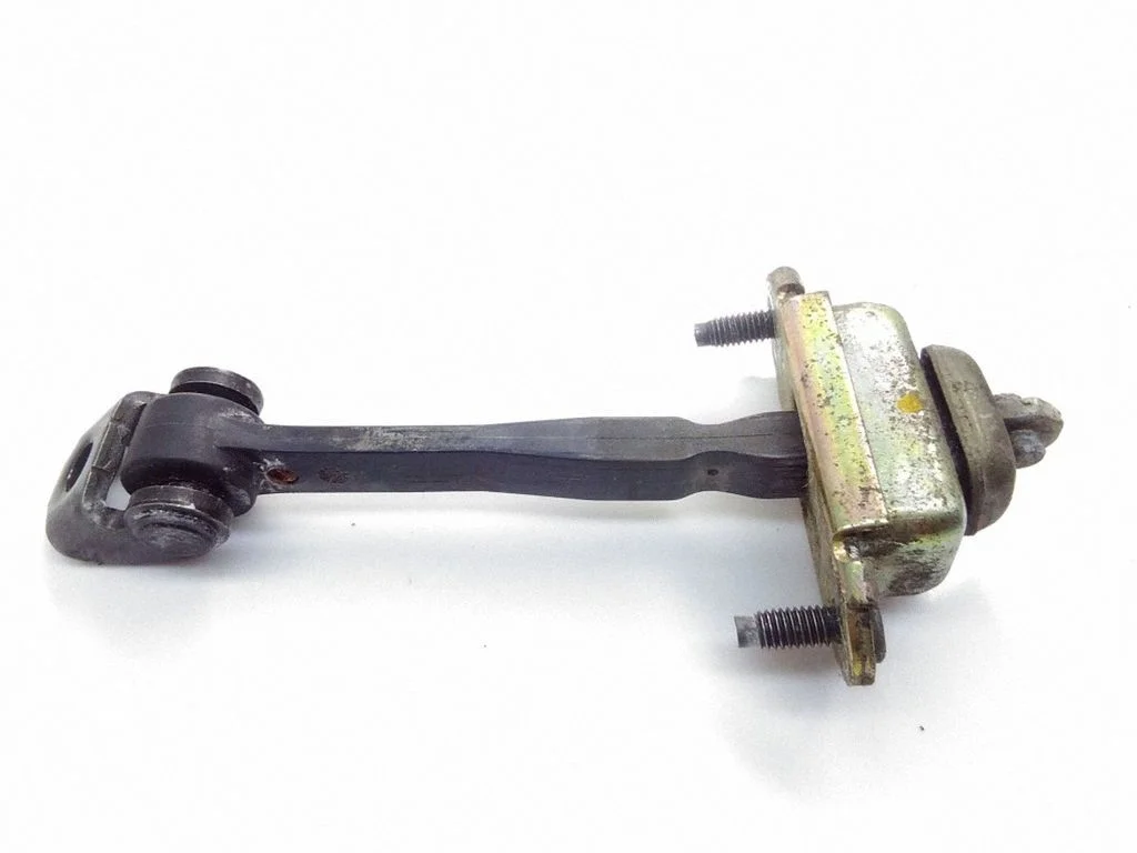 Rear door check strap stopper – left